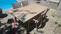 overall view of metal patio table with four chairs