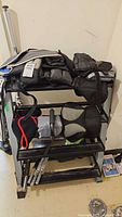 Overview of rack showing weighted vests, ankle weights, push-up handle, dumbbell handles