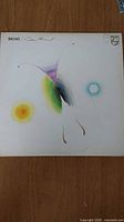 Front cover of Caetano Veloso Bicho LP showing abstract butterfly artwork with pastel colors on white background.