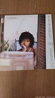 Front cover of Djavan's 1982 album 'Faltando um Pedaço'. Photograph of Djavan, album title and artist name visible.