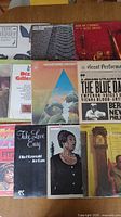 Lot of 10 jazz vinyl record albums laid out on a table