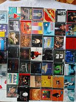 Photo showing 50 jazz CDs arranged in rows featuring various artists and cover arts.
