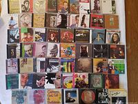 Overview photo showing approximately 60 Brazilian music CDs arranged in multiple rows with visible album covers and titles.