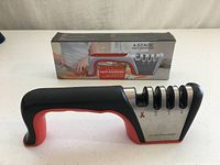 Sharpener front view with retail box showing product and slot numbers