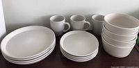 Full set showing stacks of dinner plates, salad plates, cereal bowls and mugs