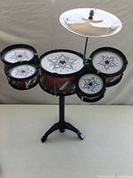 Fully assembled toy drum set frontal view