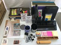 Wide view of assorted office supplies on table