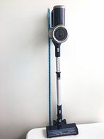 Vacuum assembled in upright position beside ruler for scale