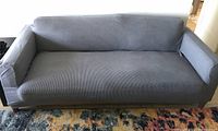 Slipcover fitted on sofa front view