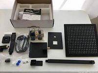 Full kit laid out including shower head, valve, arm and fittings