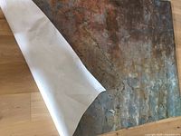 Vinyl wrap sheet partially peeled showing backing paper