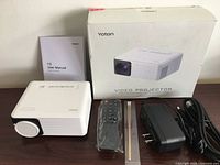 Projector with accessories and box