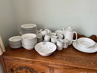 Entire dinnerware set on sideboard