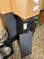 Boston Acoustics T830 speaker with grille removed and second speaker partially visible