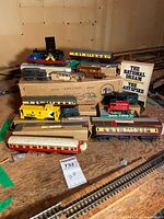 Group view of all HO scale cars, locomotive and book