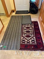 All three floor coverings laid out: runner, doormat, area rug
