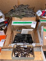 assorted straight, curved track and switches in boxes