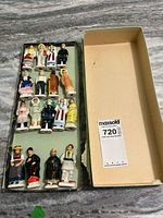 Box with 17 figurines displayed