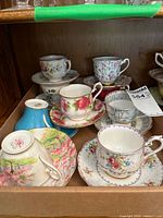 Tray of assorted tea cups and saucers
