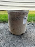 Front view of stoneware crock showing crown mark and overall condition