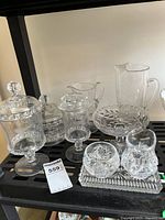 Shelf view showing majority of glass items together