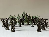 All 32 bronze chess pieces arranged in starting formation