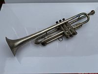 Full view of silver-plated C.G. Conn 40B trumpet