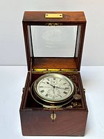 Chronometer in mahogany case open showing dial