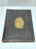 Front cover of leather-bound book showing full view