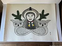 Full view of the Kenojuak Ashevak print showing woman and two owls