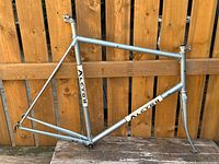 Full view of Alcyon frame and fork against fence, shows overall paint colour and decals
