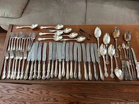 All flatware pieces laid out on table