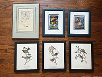 Six framed prints laid out, showing variety
