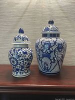 Both ginger jars side by side showing relative sizes and patterns