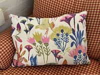 Full view of pillow front on checked chair