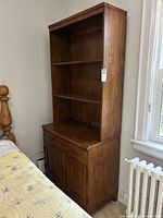 Full view of Ethan Allen two-piece bookshelf showing upper hutch and lower cabinet