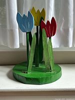 Full view of wooden tulip display showing overall shape and colors