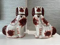 Front view of both ceramic spaniels