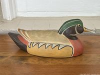 Left side view of painted porcelain duck decoy