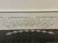 All eight Riedel wine glasses lined up to show full set