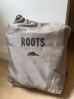 Drawstring storage bag with Roots Outdoor logo
