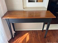 Front view of two-tone Shaker-style wood console table