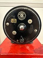 Front face of Allcocks Marvel reel showing branding and hardware