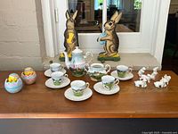 full lot showing tea set, pull toys, egg containers, small figurines