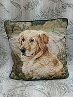 Front view of pillow showing entire needlepoint design