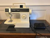 Full view of Singer 6211C sewing machine with foot pedal