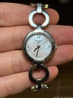 Front view of Tissot Pinky watch showing dial and bracelet links