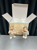 Pair of Lenox Dwarfs salt and pepper shakers with original box and certificate.