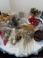 Overall view of assorted Christmas floral supplies on table