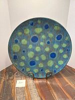 Front view of decorative plate on stand